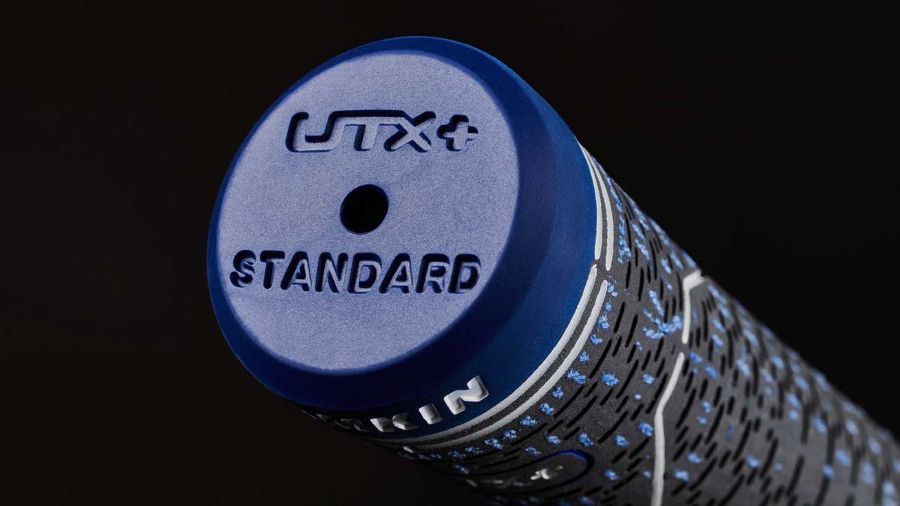 closeup of an end cap of a UTX Plus swing grip from Lamkin Golf Grips