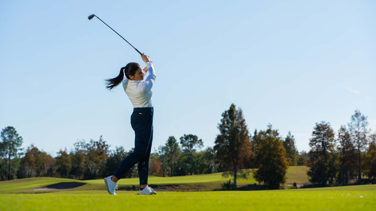 Female golfer playing a shot