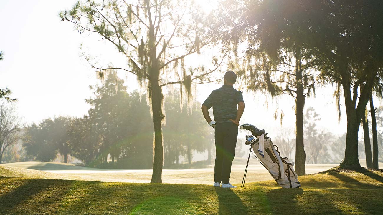 Golfer staring out at the green