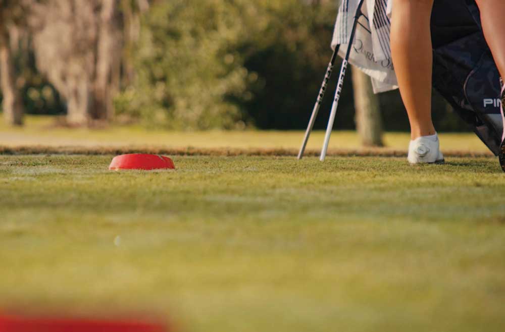 red tee on a golf green