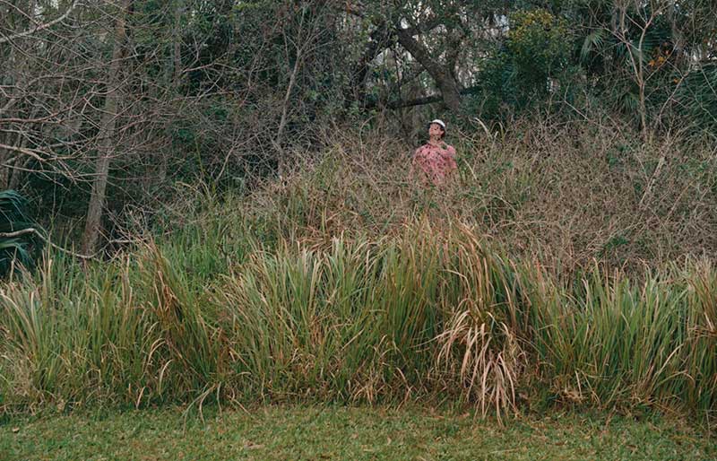 golfer playing out of the deep rough