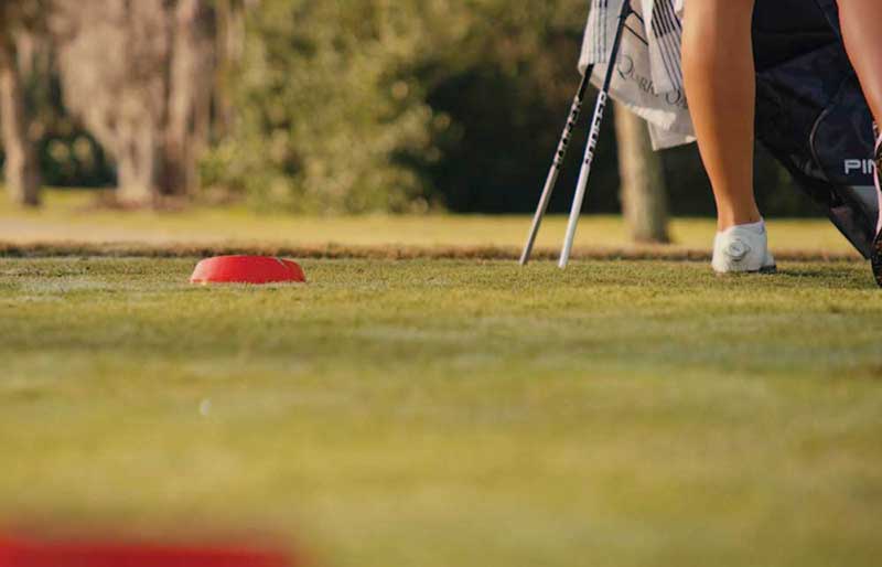 red tee on a golf course